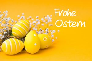 Beautiful colorful Easter eggs. Easter concept isolated on orange or yellow background.